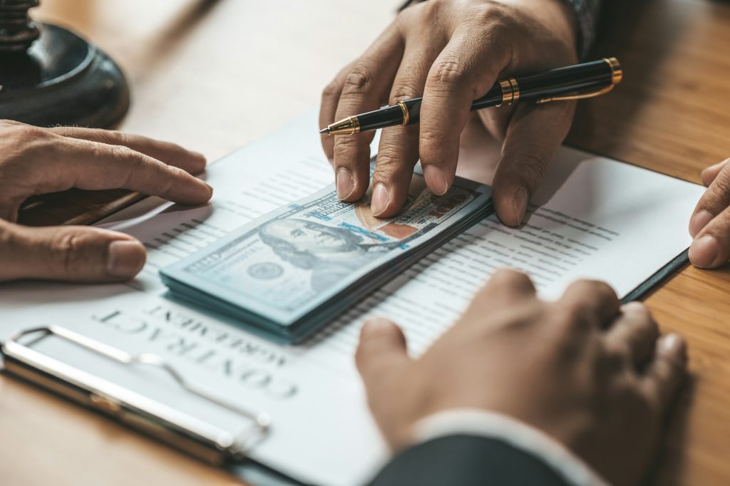 Businessmen are getting a lot of dollars from their business partners as money for bribery.